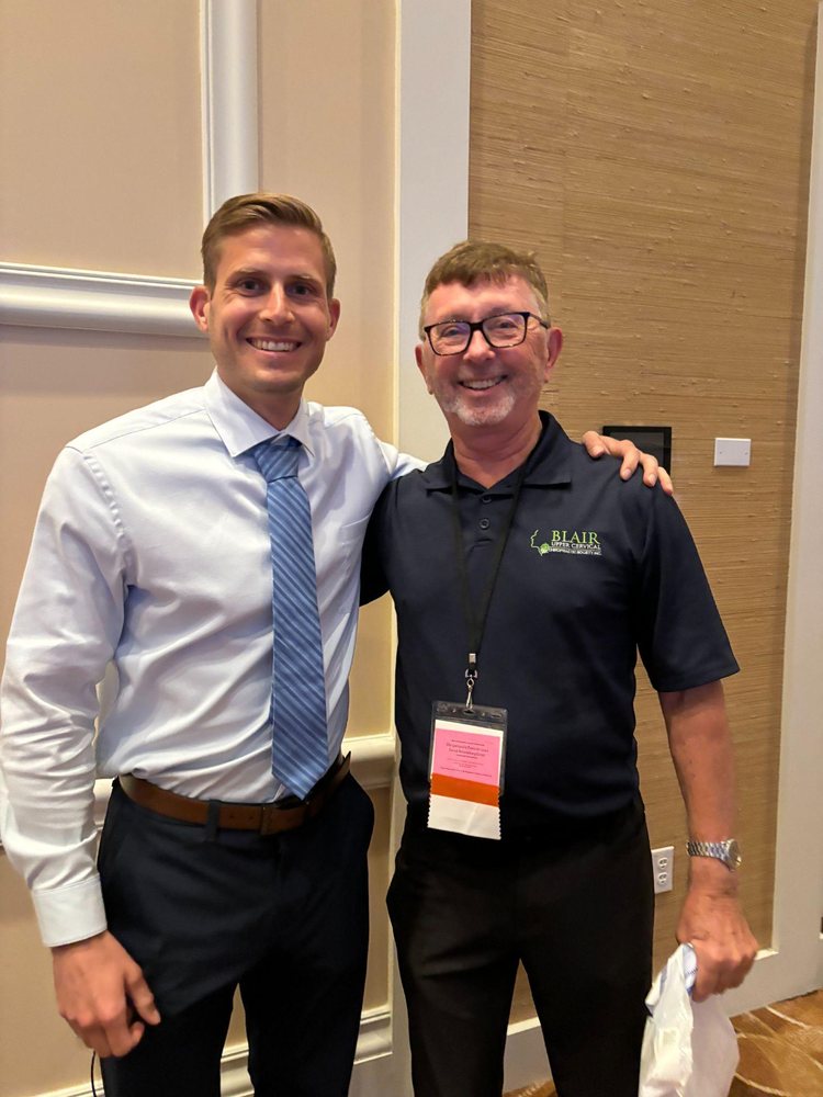Dr. Marsh standing with a colleague at an event